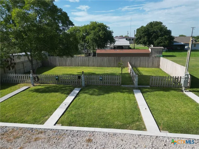 a view of a backyard with a small pool