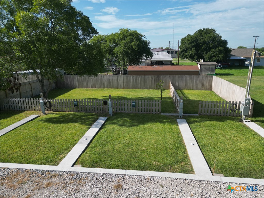 507 East Plasuela Street Refugio, TX 78377 - Photo 9 of 18 a view of a backyard with a small pool