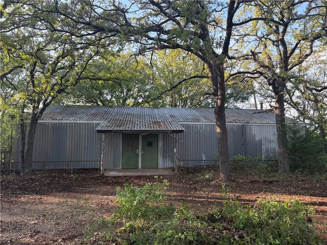 a view of a house with a tree