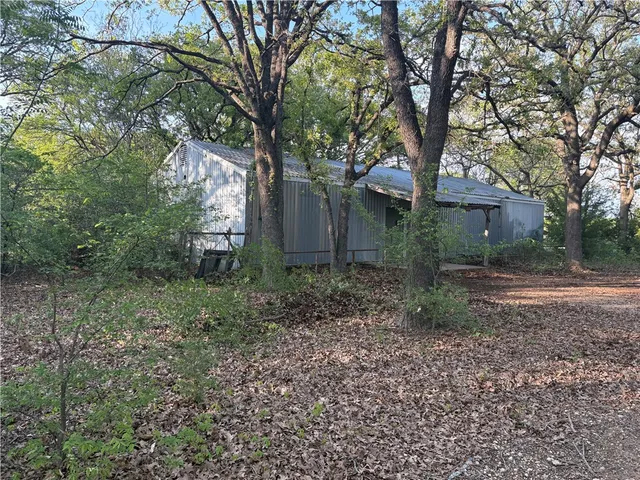 a backyard of a house with lots of green space