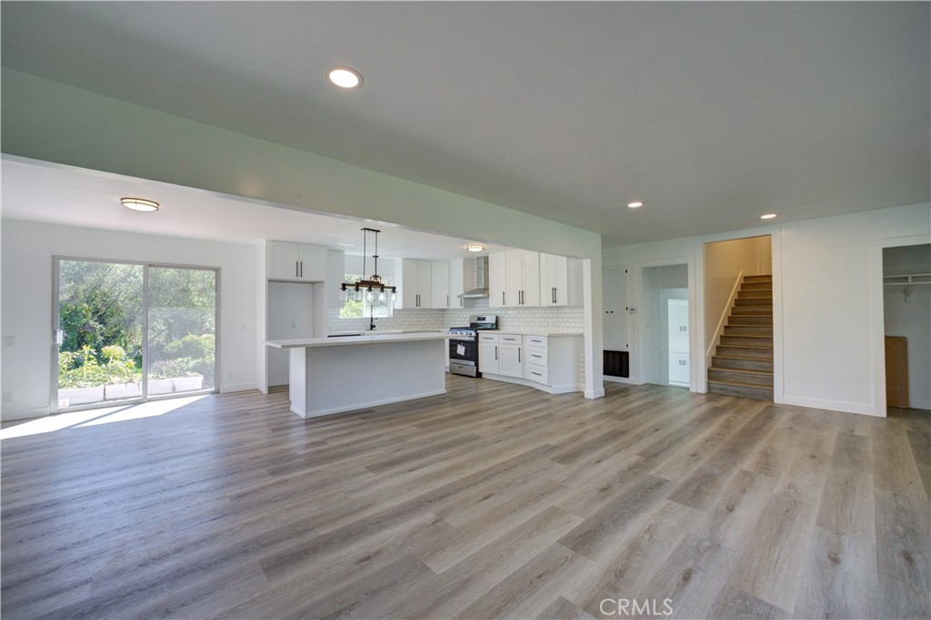 1550 Main Street Cambria, CA 93428 - Photo 7 of 9 a view of kitchen with kitchen island wooden cabinets and refrigerator