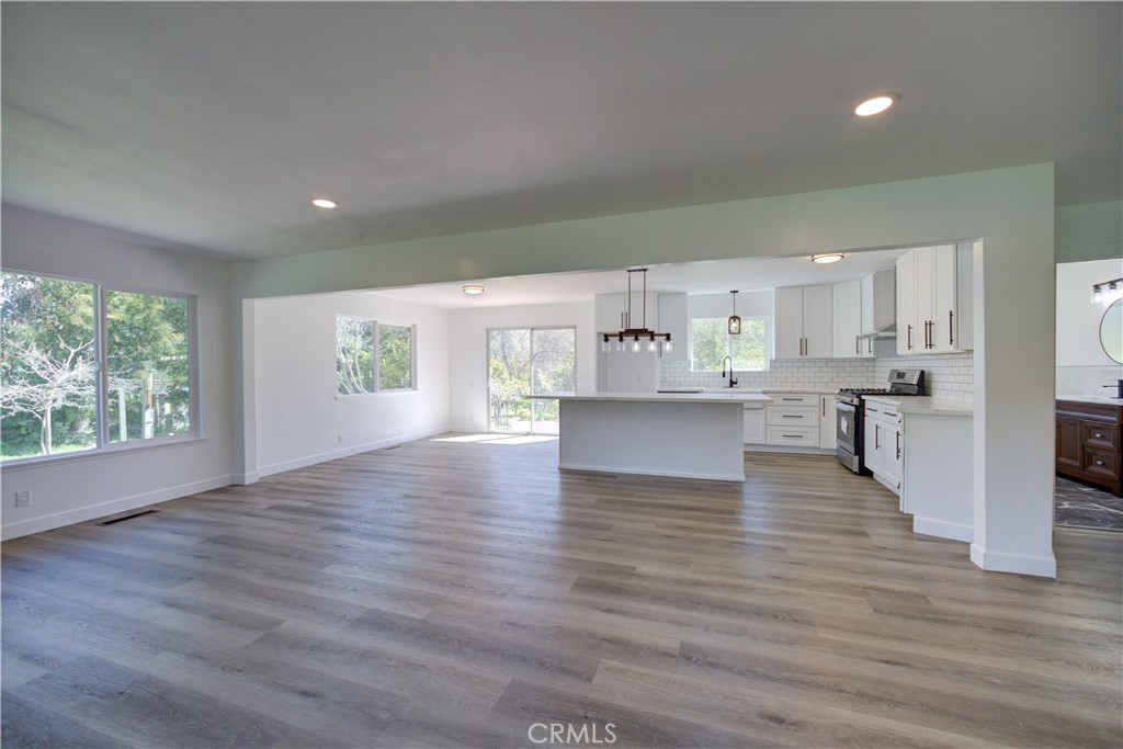 1550 Main Street Cambria, CA 93428 - Photo 8 of 9 a view of kitchen with wooden floors and kitchen view