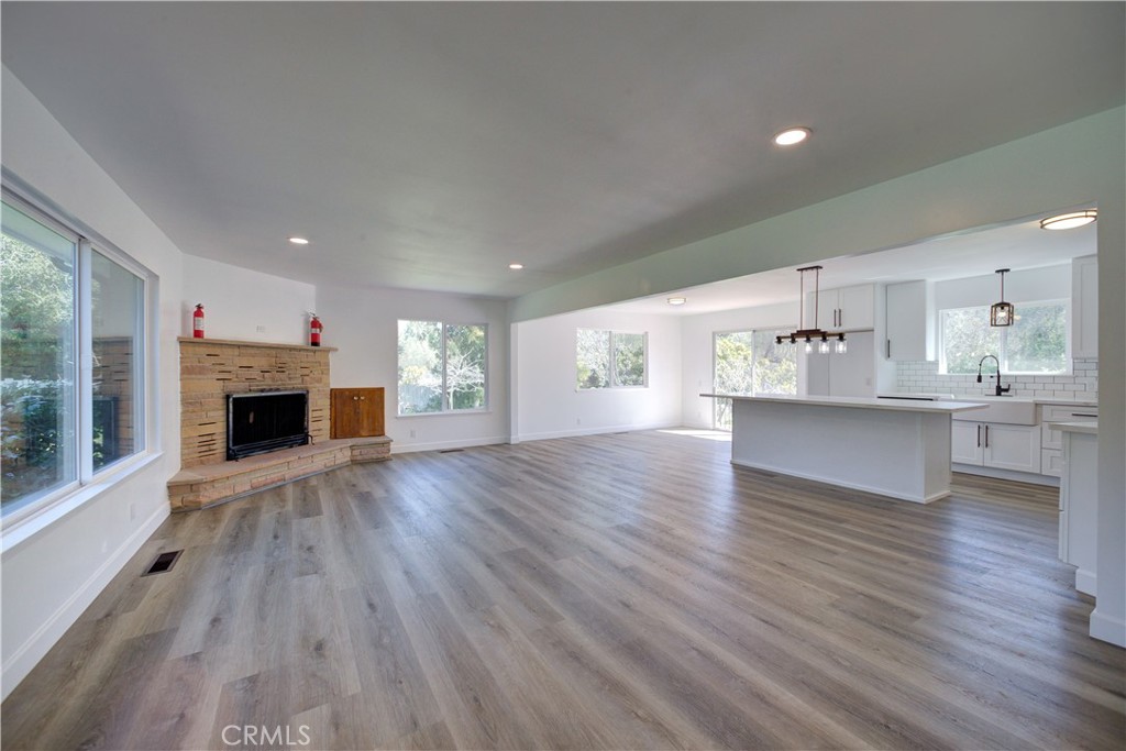 1550 Main Street Cambria, CA 93428 - Photo 9 of 9 a view of an empty room with a fireplace and window