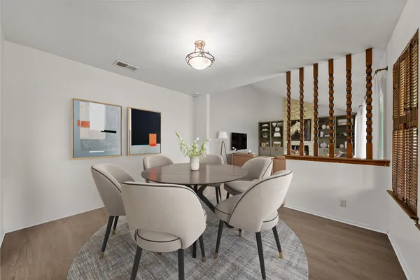 a dining room with furniture and window