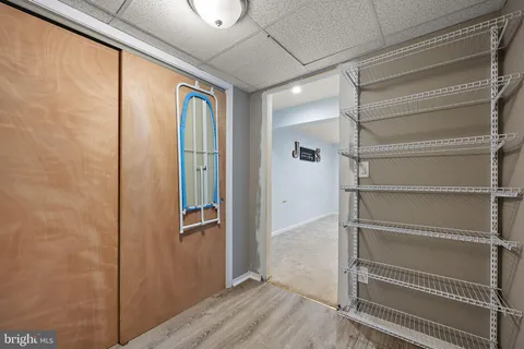 a white toilet sitting next to a bathroom sink