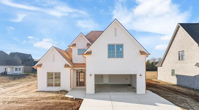 a view of a white house with a large windows