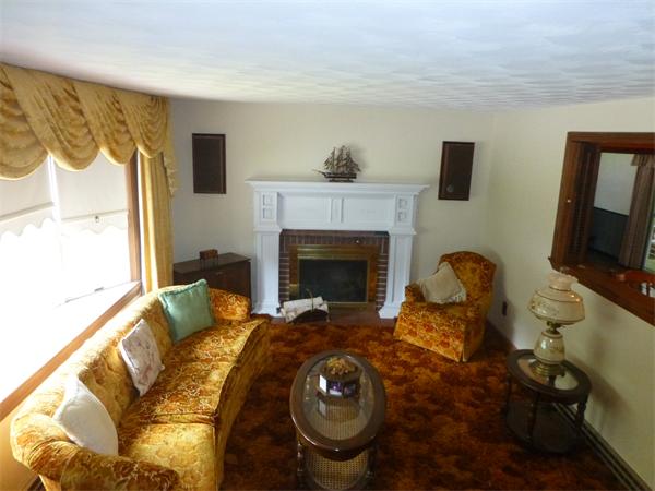 9 Sandberg Road Billerica, MA 01821 - Photo 12 of 23 a living room with furniture and a fireplace