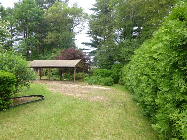 9 Sandberg Road Billerica, MA 01821 - Photo 7 of 23 a view of a backyard with a garden