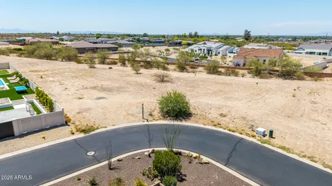 a view of a lake with beach and mountain view