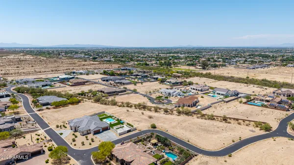 an aerial view of residential houses and outdoor space