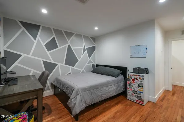 a bed room with a bed and a couch