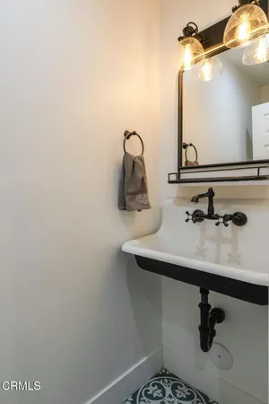 a bathroom with a sink and mirror