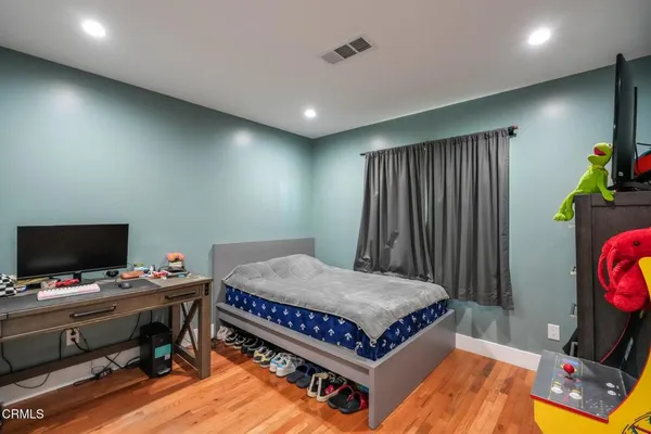 a very nice looking bedroom with a big bed and a flat screen tv