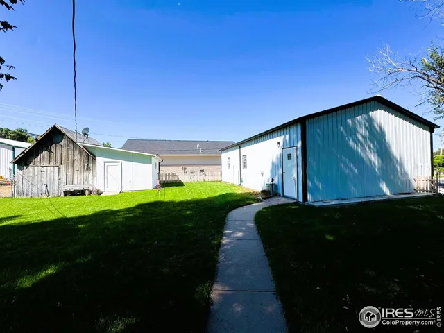 a view of backyard with a garden and entertaining space