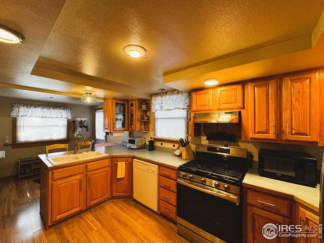 a kitchen that has a stove and a microwave