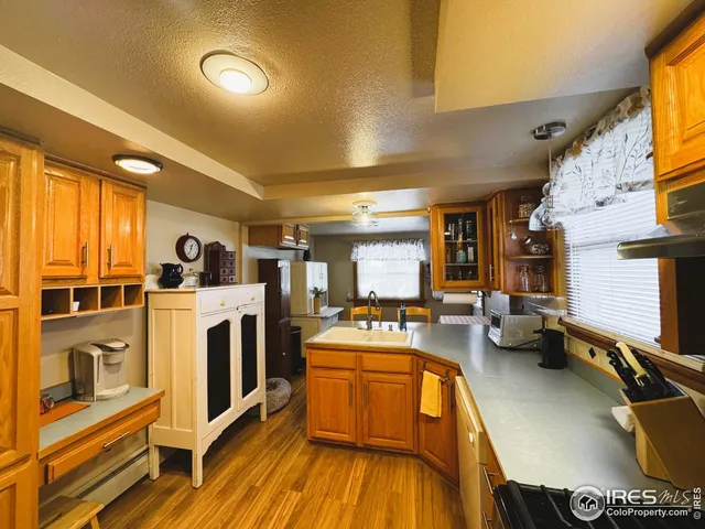 a kitchen with stainless steel appliances granite countertop a sink and cabinets