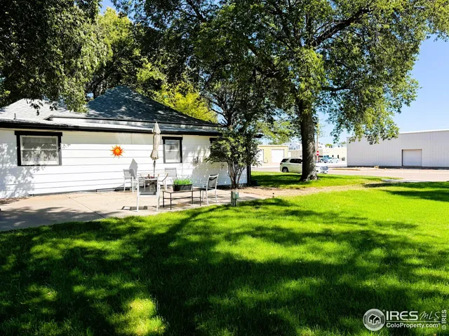 a view of yard with patio