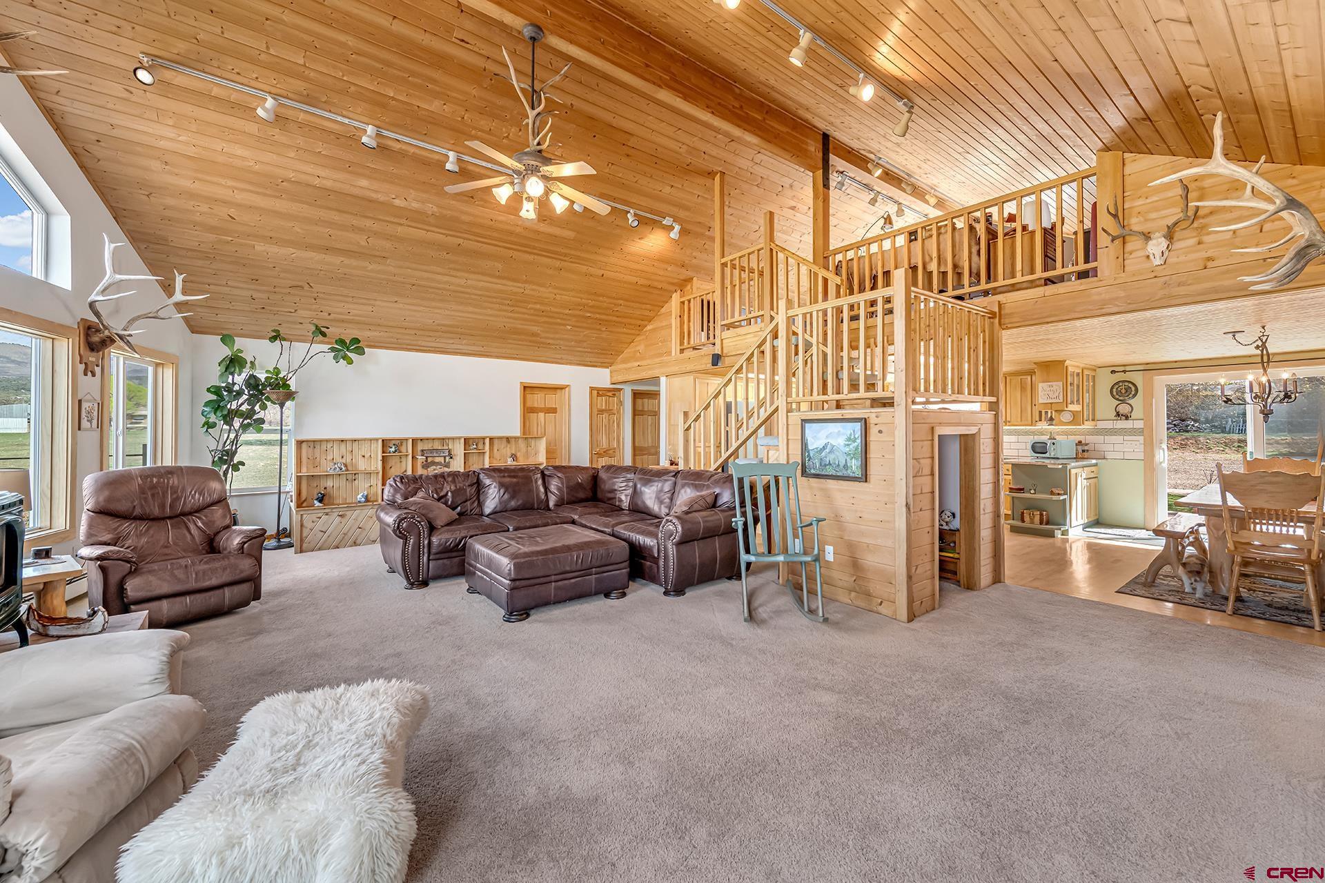 19122 2325th Road Cedaredge, CO 81413 - Photo 16 of 45 a living room with furniture