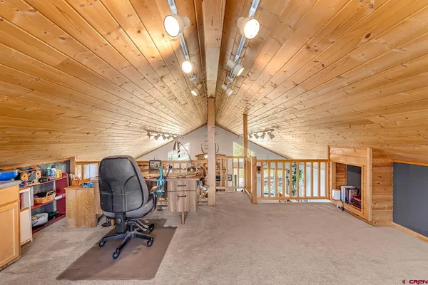 a bed room with a bed and a baby crib