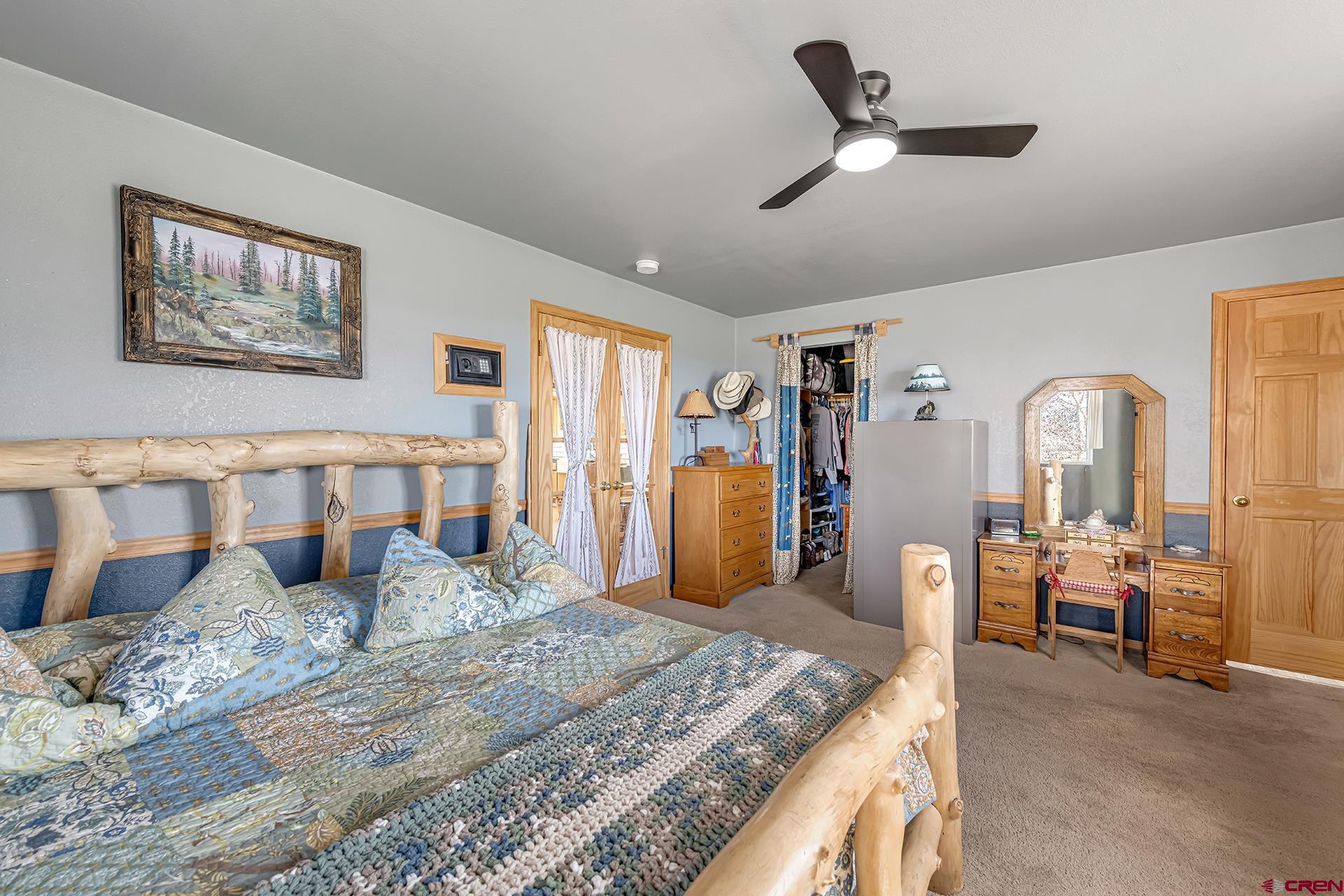 19122 2325th Road Cedaredge, CO 81413 - Photo 21 of 45 a living room with furniture