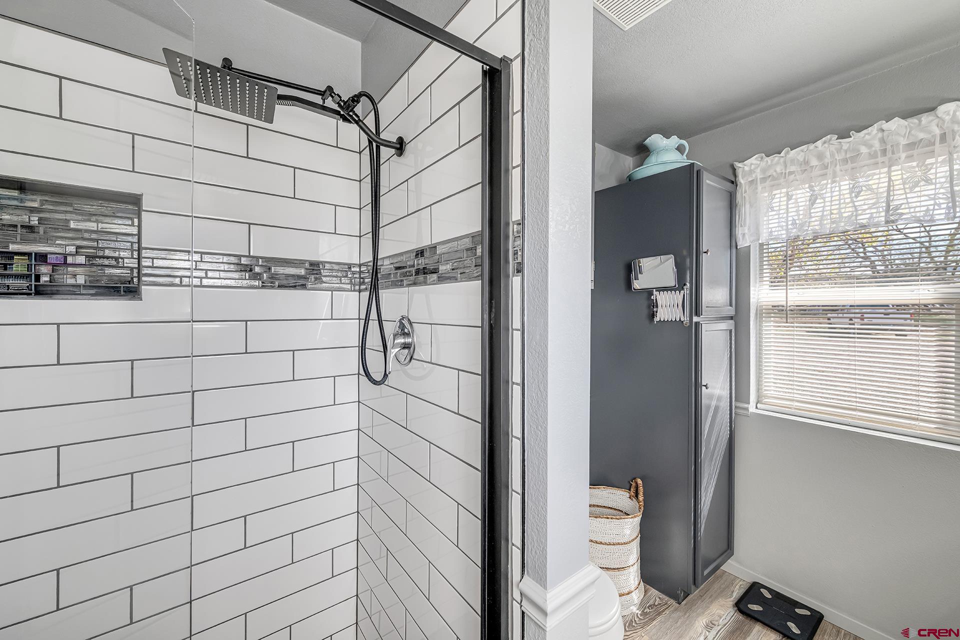 19122 2325th Road Cedaredge, CO 81413 - Photo 22 of 45 a bathroom with a shower