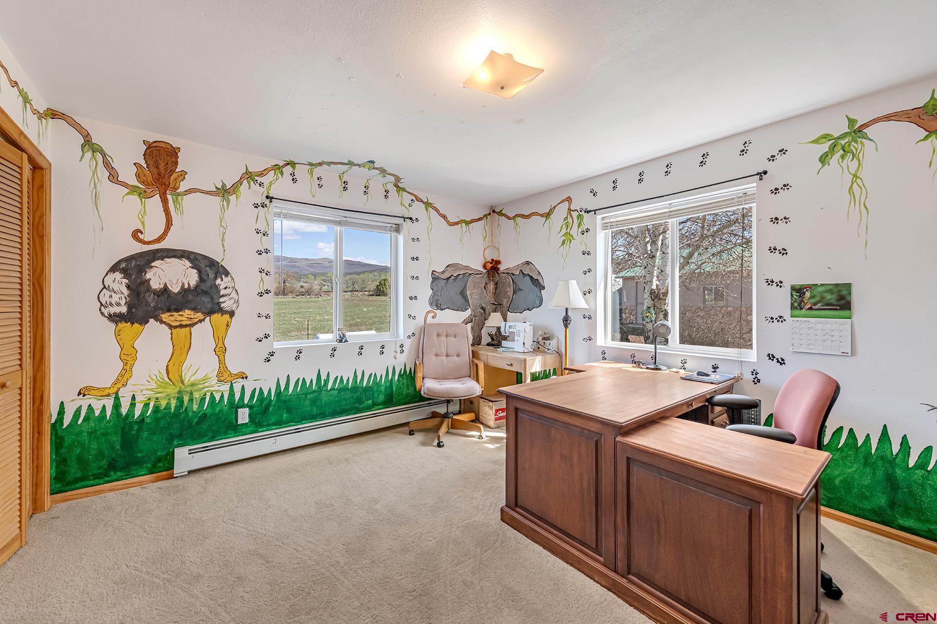 19122 2325th Road Cedaredge, CO 81413 - Photo 24 of 45 a room with furniture and a window