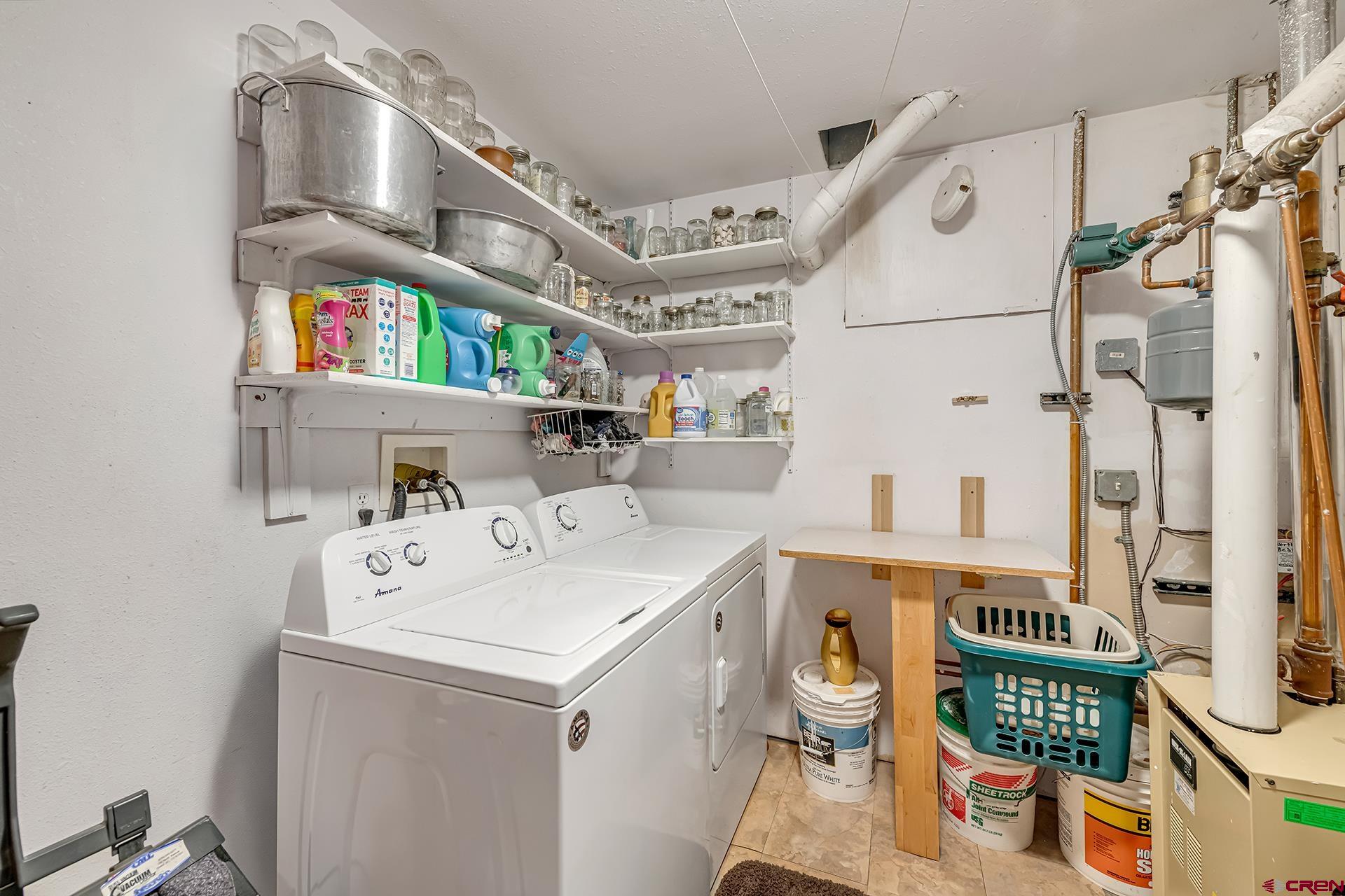 19122 2325th Road Cedaredge, CO 81413 - Photo 36 of 45 a utility room with dryer and washer