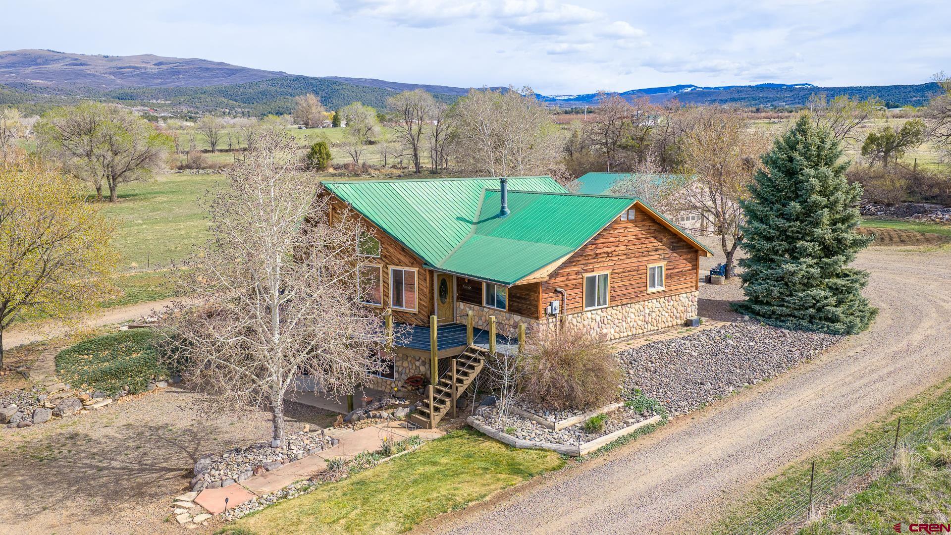 19122 2325th Road Cedaredge, CO 81413 - Photo 43 of 45 a view of a house with a ocean view