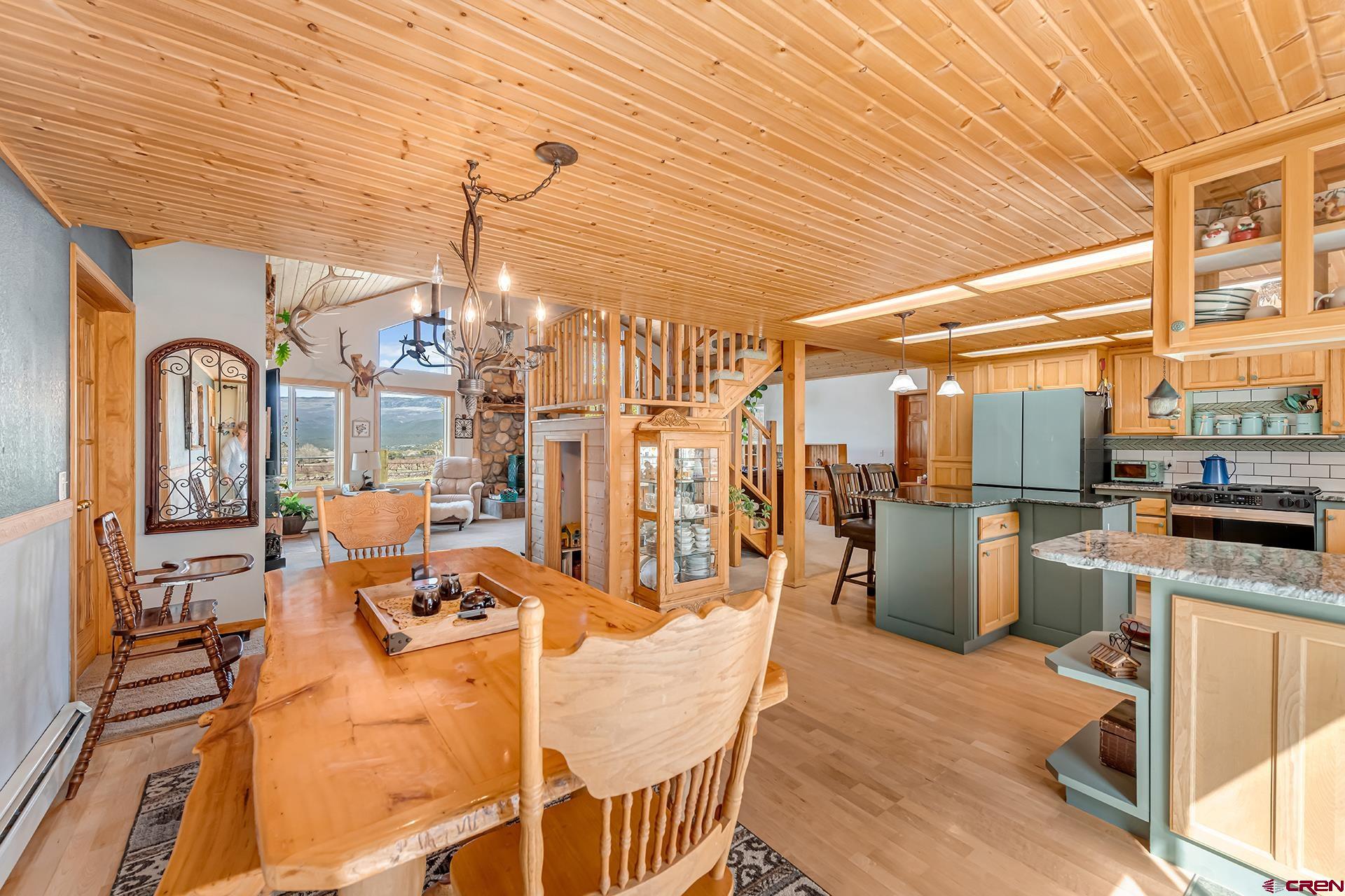 19122 2325th Road Cedaredge, CO 81413 - Photo 9 of 45 a view of a dining room with furniture