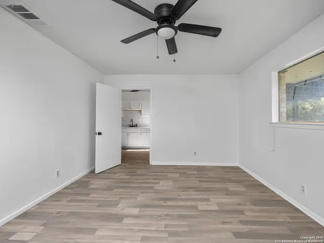 a view of an empty room and window