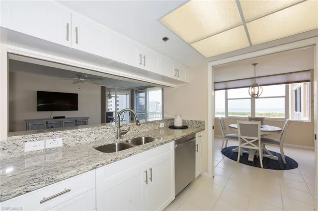 a kitchen with center island and sink