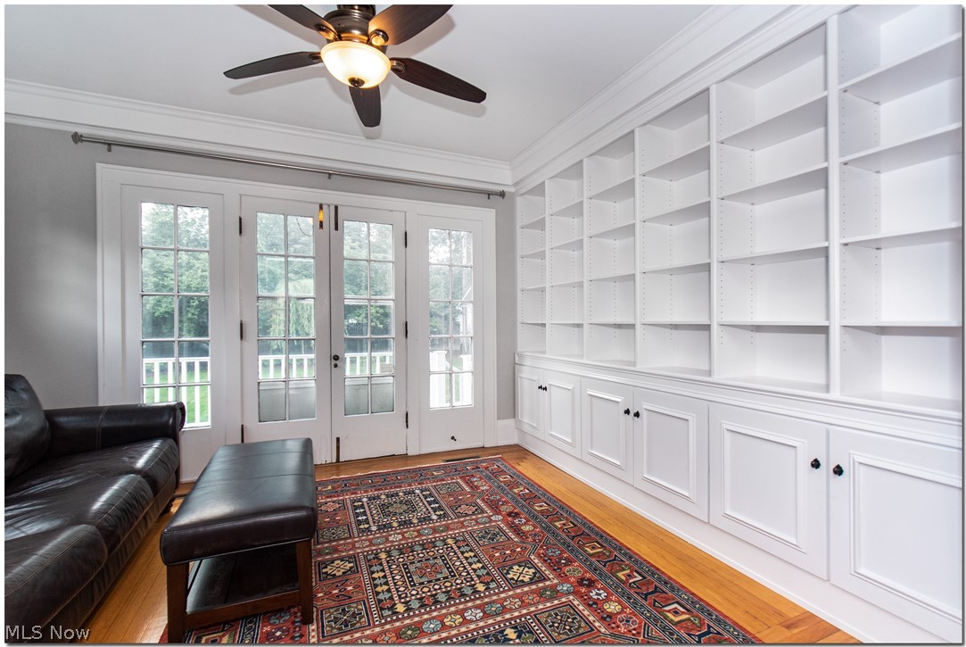 2177 South Overlook Road Cleveland, OH 44106 - Photo 5 of 35 Library with custom cabinetry and walks out to a patio