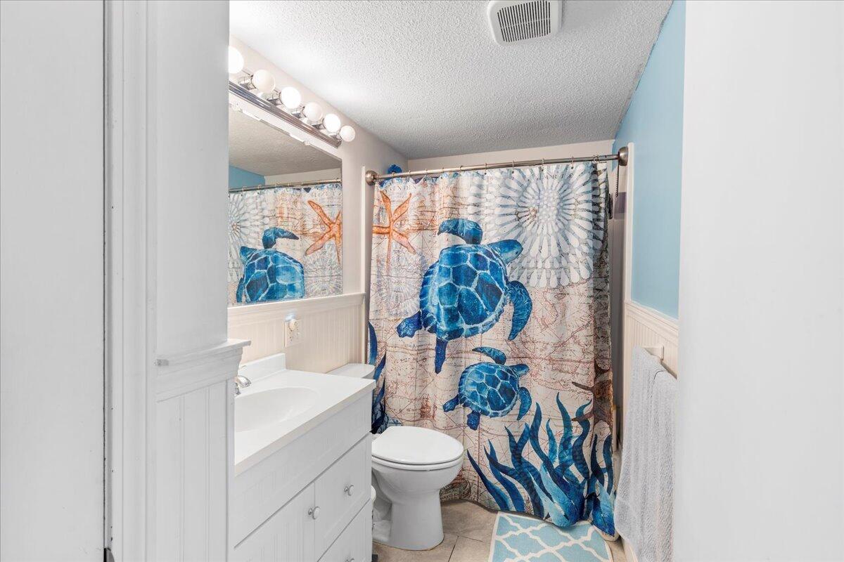 66 Barker Road Wareham, MA 02538 - Photo 13 of 18 a white toilet sitting next to a bathroom sink