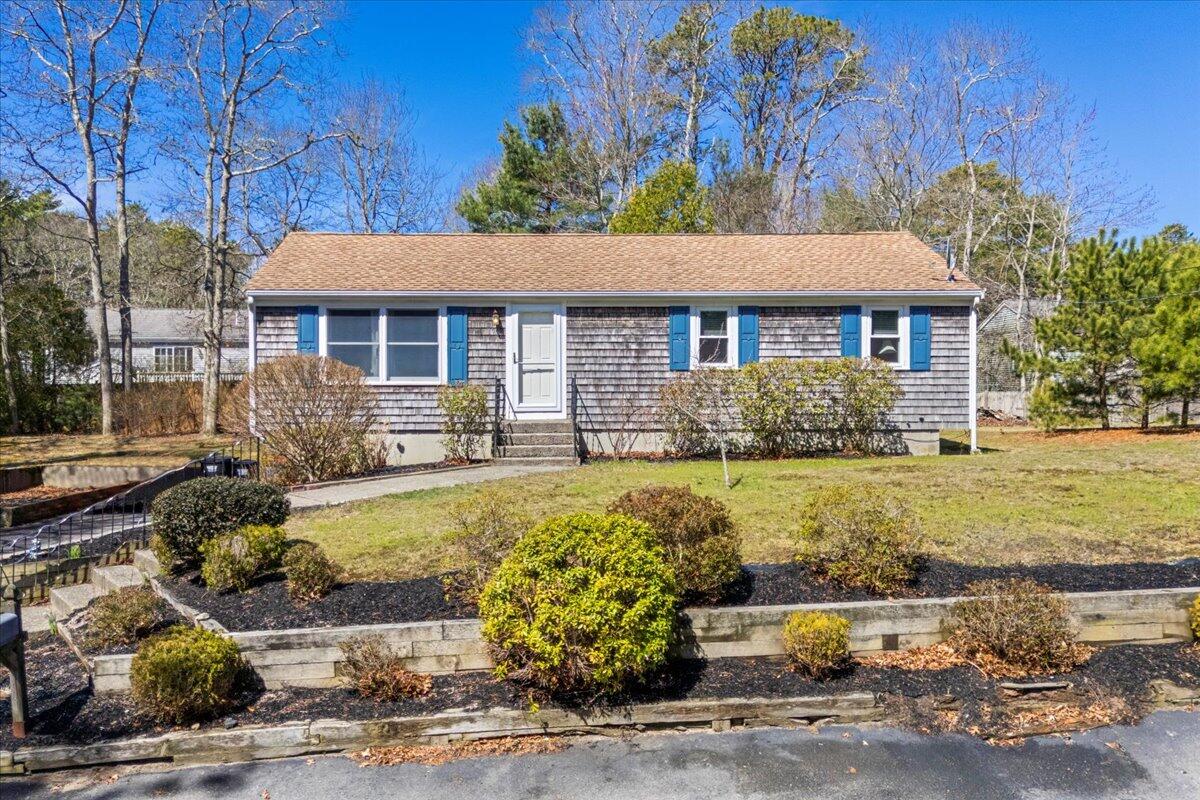 66 Barker Road Wareham, MA 02538 - Photo 2 of 18 a front view of a house with garden