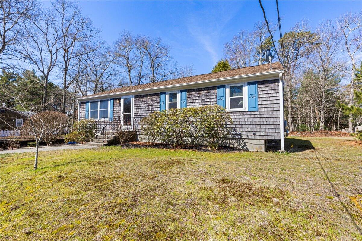 66 Barker Road Wareham, MA 02538 - Photo 3 of 18 a front view of a house with garden