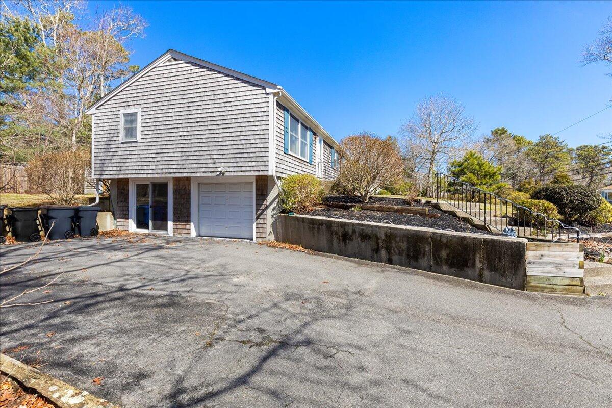 66 Barker Road Wareham, MA 02538 - Photo 5 of 18 a front view of a house with a yard