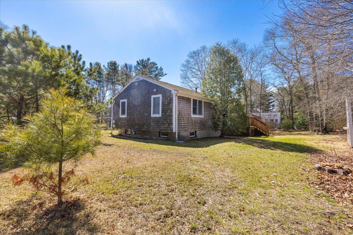 66 Barker Road Wareham, MA 02538 - Photo 7 of 18 a view of a yard with large trees