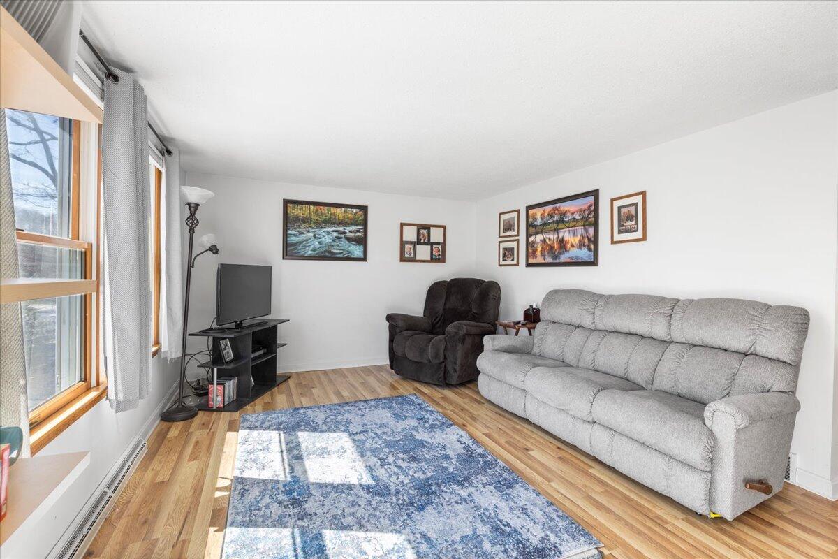 66 Barker Road Wareham, MA 02538 - Photo 8 of 18 a living room with furniture and a flat screen tv