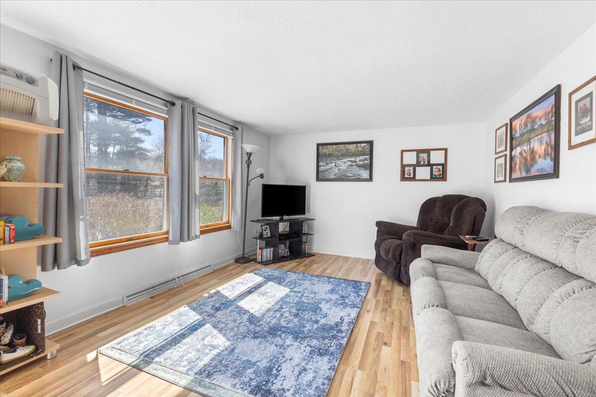 66 Barker Road Wareham, MA 02538 - Photo 9 of 18 a living room with furniture and a flat screen tv