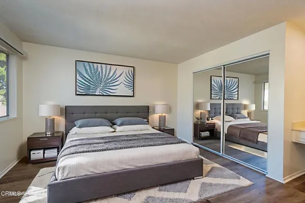 a view of a dining room with furniture and a chandelier