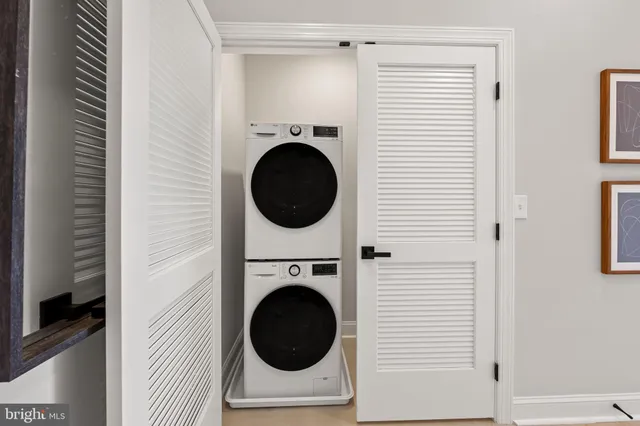 a view of a hallway with washer and dryer