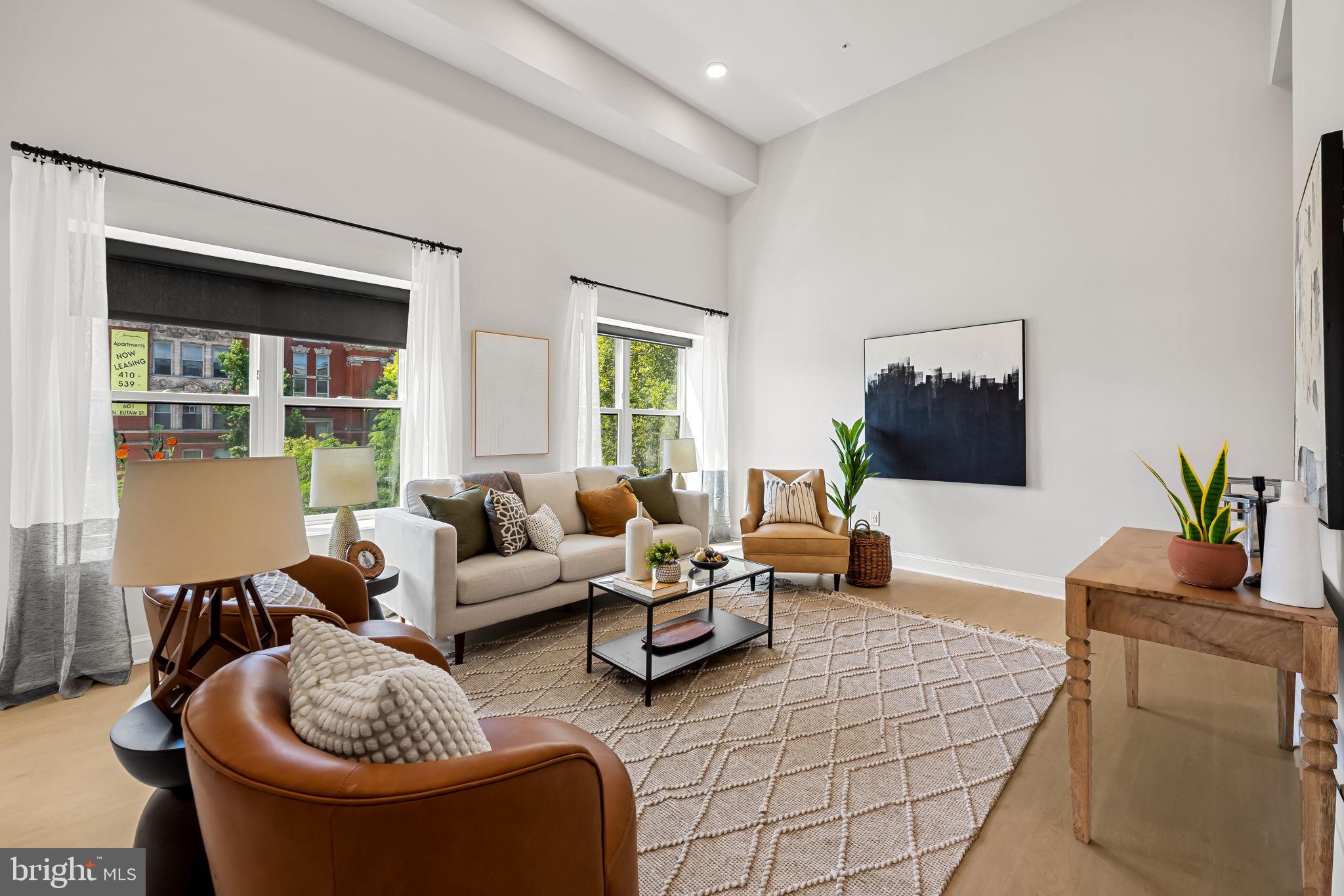 600 North Howard Street, Unit 502 Baltimore, MD 21201 - Photo 2 of 20 a living room with furniture and a large window