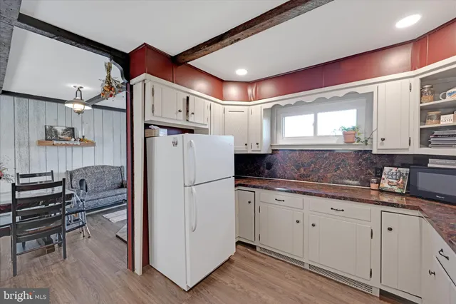 a bedroom with a bed and dresser