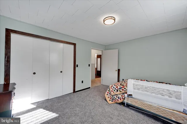 a view of a hallway with windows and stairs