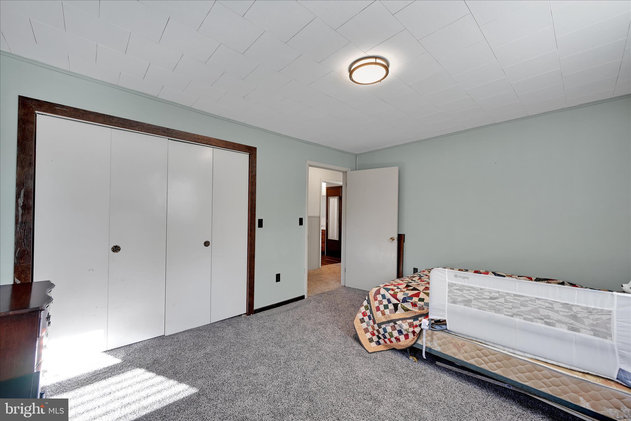 175 Strack Drive Myerstown, PA 17067 - Photo 28 of 52 a bedroom with a bed and a chandelier