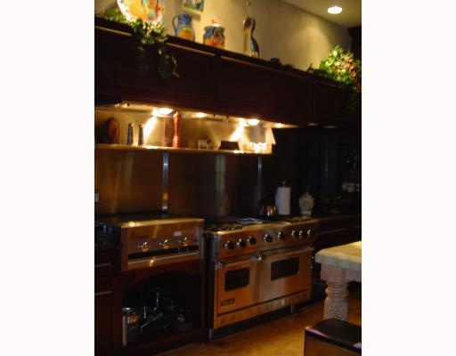 610 Elm Street Portland, TX 78374 - Photo 6 of 10 a kitchen with a stove and a microwave