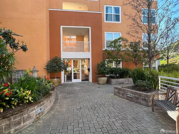 a view of a building with outdoor space and plants