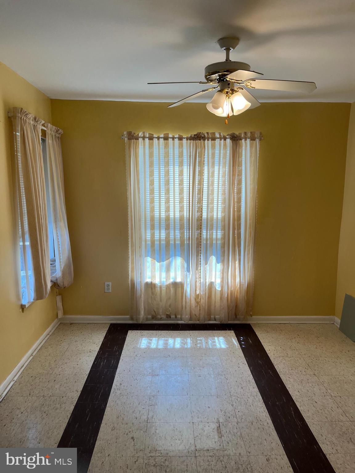 3801 St Barnabas Road, Unit T 102 Suitland, MD 20746 - Photo 5 of 8 wooden floor in an empty room with a window