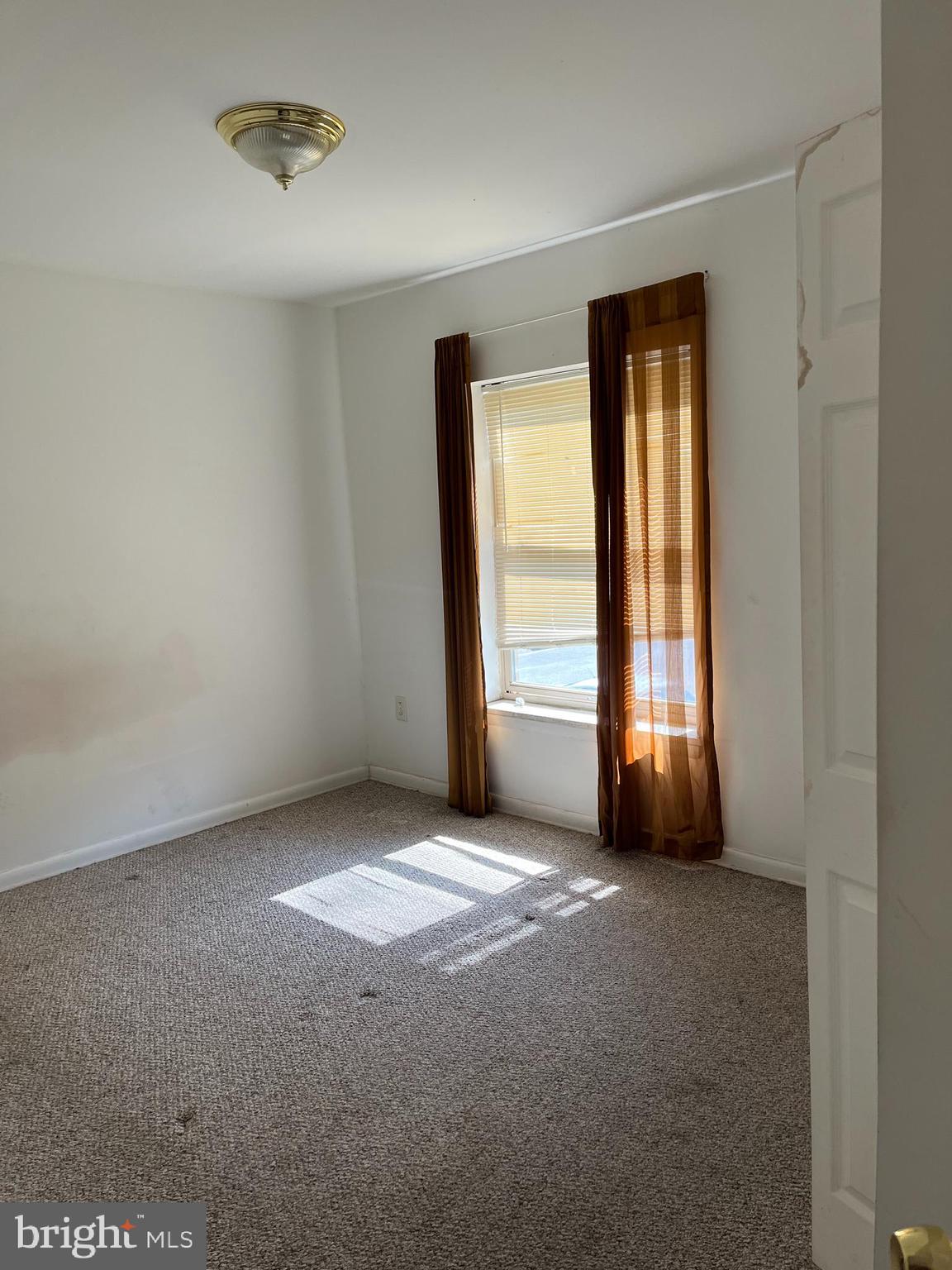 3801 St Barnabas Road, Unit T 102 Suitland, MD 20746 - Photo 8 of 8 an empty room with windows