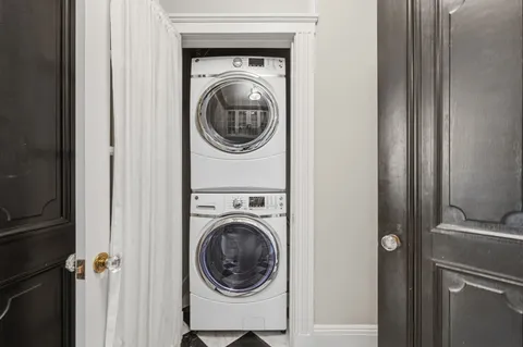 a view of a hallway with washer and dryer